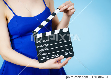 Woman holding professional film slate Woman holding professional film slate 120386781