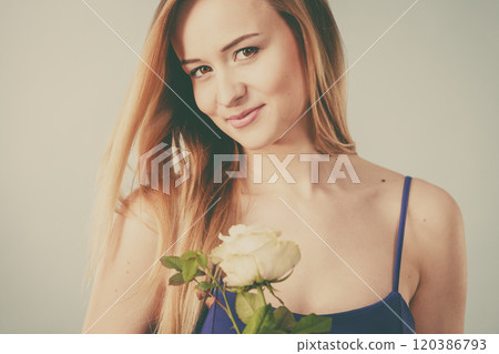 woman holding white rose woman holding white rose 120386793