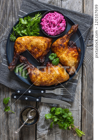 roast chicken leg quarters with a beetroot salad 120387699