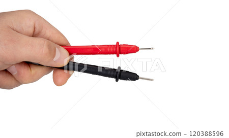Hand Holding Red and Black Multimeter Probes Horizontally Hand Holding Red and Black Multimeter Probes Horizontally 120388596