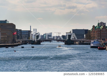 Local people riding bicycles on Knippelsbro Knippel bascule bridge across the Inner Harbour on Christianshavn, Copenhagen, Denmark Local people riding bicycles on Knippelsbro Knippel bascule bridge across the Inner Harbour on Christianshavn, Copenhagen, Denmark 120389065