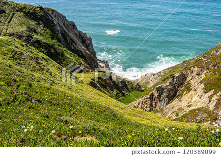 Hiking on the rocky cliffs of Cabo da Roca at the Atlantic coast of Portugal, Europe 120389099
