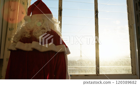 Santa Claus Waving The Hand At The Window  120389682
