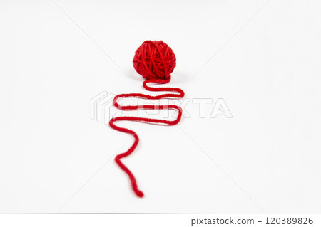 Red skein of thread against white background. Red ball of wool red thread isolated on white 120389826
