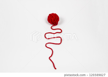 Red skein of thread against white background. Red ball of wool red thread isolated on white 120389827