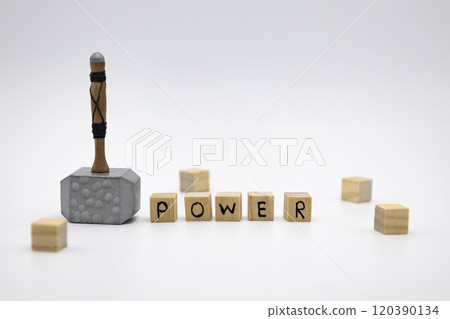 The wooden cubes with the word POWER and the weapon around against white background. The hammer is medieval weapon 120390134