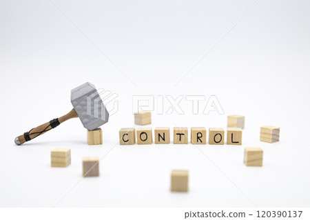 The wooden cubes with the word CONTROL and the weapon around against white background. The medieval hammer on a wooden cube. 120390137