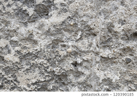 A Stone wall as background or texture. The background texture of the stone wall. A Stone wall as background or texture. The background texture of the stone wall. 120390185