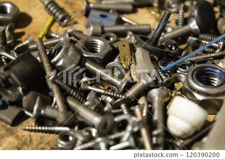 A bunch of different bolts and nuts, nails like background 120390200