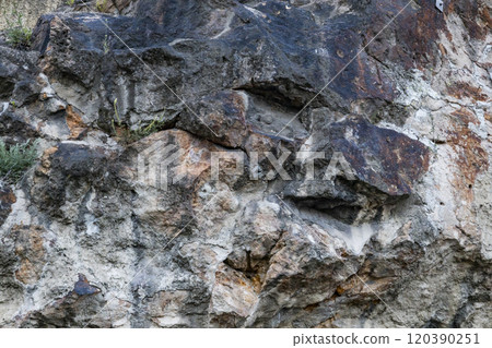 The background with stones. Stone wall background.  Old wall cement texture. 120390251