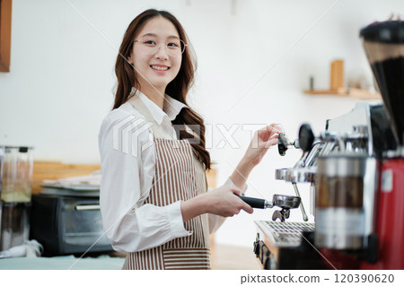 Dedicated barista preparing coffee, demonstrating professionalism and skill in a cafe setting. 120390620