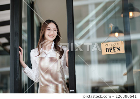 Cafe staff or owner opening the shop door, inviting customers with a friendly to start the day. Cafe staff or owner opening the shop door, inviting customers with a friendly to start the day. 120390641