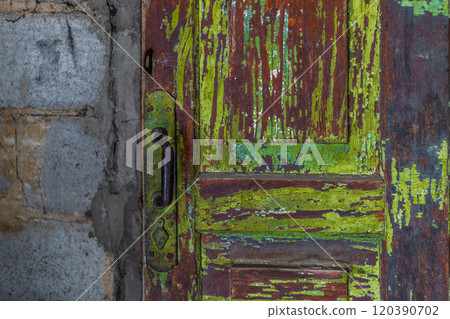 shabby wooden door with peeped green paint and steel handle shabby wooden door with peeped green paint and steel handle 120390702
