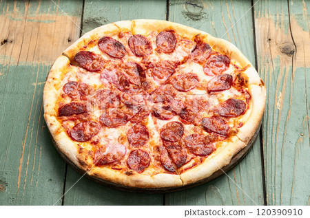 Pizza pepperoni fast food . Top view on rustic background Pizza pepperoni fast food . Top view on rustic background 120390910