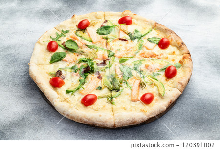 Italian pizza with avocado salmon tomatoes and mozzarella photography. top view Italian pizza with avocado salmon tomatoes and mozzarella photography. top view 120391002