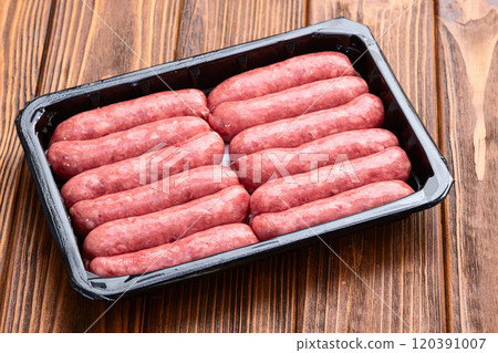 Raw beef sausages with rosemary and tomatoes photography . Top view Raw beef sausages with rosemary and tomatoes photography . Top view 120391007