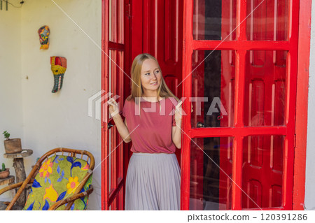 Female tourist in a colonial house in San Cristobal de las Casas, Mexico. Cultural exploration, architecture, and travel experience concept Female tourist in a colonial house in San Cristobal de las Casas, Mexico. Cultural exploration, architecture, and travel experience concept 120391286