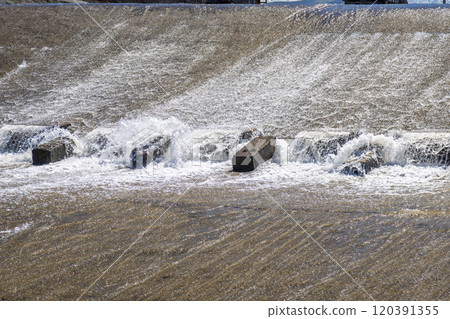 chute dentate blocks in concrete water spillway channel 120391355