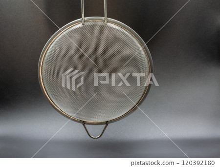 Metallic colander for cooking closeup. Metallic colander for cooking closeup. 120392180