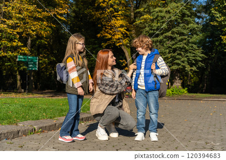Friends feeling great together during happy walk in park Friends feeling great together during happy walk in park 120394683