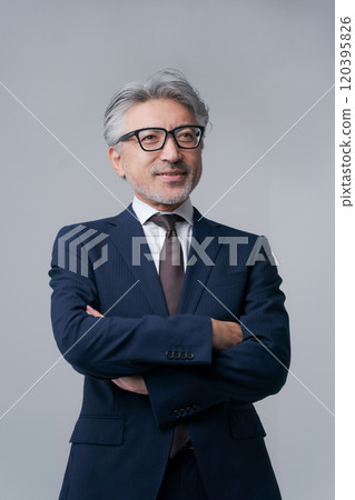 A businessman wearing glasses A businessman wearing glasses 120395826
