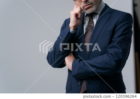 Businessman with arms folded Businessman with arms folded 120396264