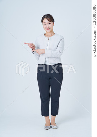 A businesswoman posing to guide or point out A businesswoman posing to guide or point out 120396396