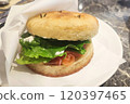 Smoked salmon bagel on white plate 120397465