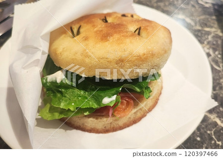 Smoked salmon bagel on white plate 120397466