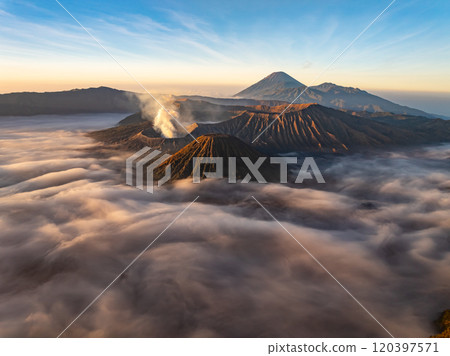 Aerial view Mountains at Bromo volcano during sunrise sky,Beautiful Mountains Penanjakan in Bromo Tengger Semeru National Park,East Java,Indonesia.Nature landscape background Aerial view Mountains at Bromo volcano during sunrise sky,Beautiful Mountains Penanjakan in Bromo Tengger Semeru National Park,East Java,Indonesia.Nature landscape background 120397571
