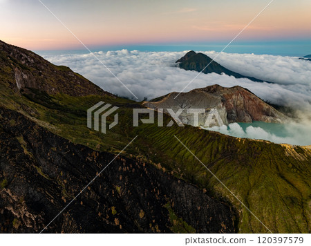 Aerial view Kawah Ijen volcano with turquoise sulfur water lake at sunrise.Amazing nature landscape view at East Java, Indonesia. Natural landscape background 120397579