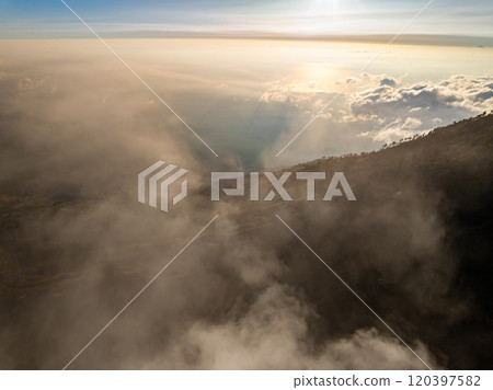 Aerial view Kawah Ijen volcano with turquoise sulfur water lake at sunrise.Amazing nature landscape view at East Java, Indonesia. Natural landscape background 120397582