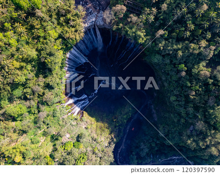 Aerial view of Panorama Tumpak Sewu Waterfalls also known as Coban Sewu.Beautiful rainbow and fog,Tumpak Sewu Waterfalls are a tourist attraction in East Java, Indonesia.Amazing travel destination Aerial view of Panorama Tumpak Sewu Waterfalls also known as Coban Sewu.Beautiful rainbow and fog,Tumpak Sewu Waterfalls are a tourist attraction in East Java, Indonesia.Amazing travel destination 120397590