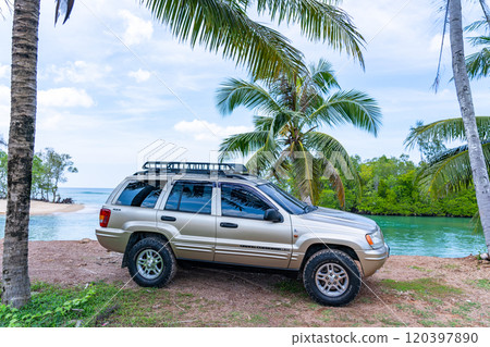 Phuket Thailand November 19, 2024: Brown American SUV Jeep Grand Cherokee WJ 2002 near the sea in Phuket Thailand,Off-road over land,View of the sea and dirt road nature landscape Phuket Thailand November 19, 2024: Brown American SUV Jeep Grand Cherokee WJ 2002 near the sea in Phuket Thailand,Off-road over land,View of the sea and dirt road nature landscape 120397890