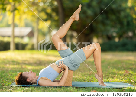 Adult woman doing yoga with blocks 120398216