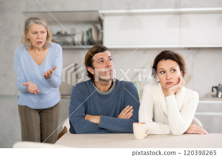 Elderly woman swears at married couple Elderly woman swears at married couple 120398265