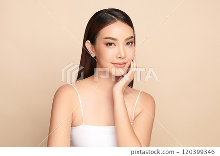 Beautiful young asian woman with clean fresh skin on beige background, Face care, Facial treatment, Cosmetology, beauty and spa, Asian women portrait. Beautiful young asian woman with clean fresh skin on beige background, Face care, Facial treatment, Cosmetology, beauty and spa, Asian women portrait. 120399346