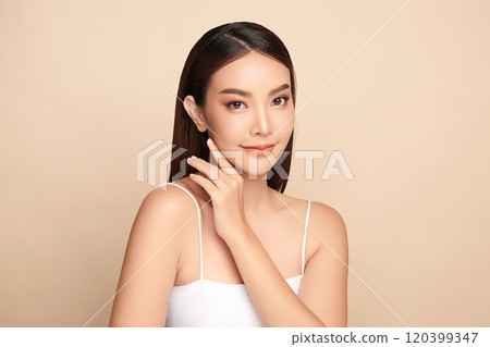 Beautiful young asian woman with clean fresh skin on beige background, Face care, Facial treatment, Cosmetology, beauty and spa, Asian women portrait. 120399347