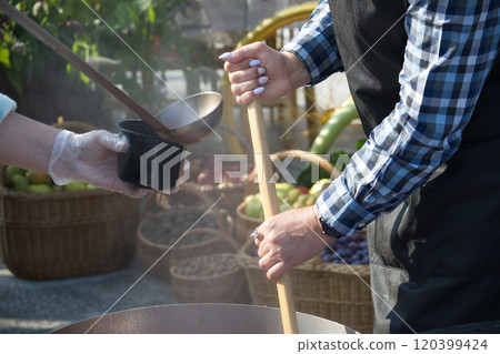 Outdoor Cooking at a Market 120399424