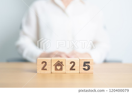 Happy New Year 2025 with Home and Heart block. Property investment, House Mortgage, Real Estate tax, homeless, donation, Financial and happy family concepts 120400079
