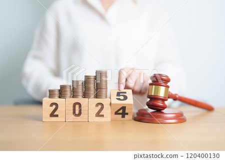 2024 end year to Happy New Year 2025 with judge gavel and money coins stack on desk. Law cost, lawyer, judgment, justice auction and bidding concepts 120400130