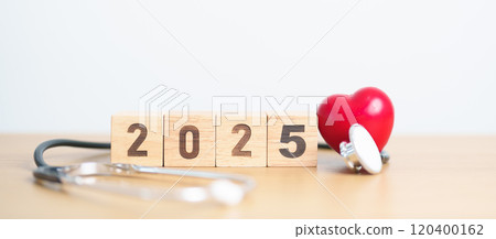 Happy New Year 2025 with Stethoscope of doctor and heart shape on table. health care, Insurance, Wellness and medical concept Happy New Year 2025 with Stethoscope of doctor and heart shape on table. health care, Insurance, Wellness and medical concept 120400162