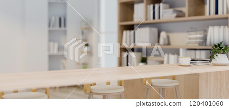 A close-up of a long wooden tabletop with stools in a contemporary office lounge or cafe. A close-up of a long wooden tabletop with stools in a contemporary office lounge or cafe. 120401060