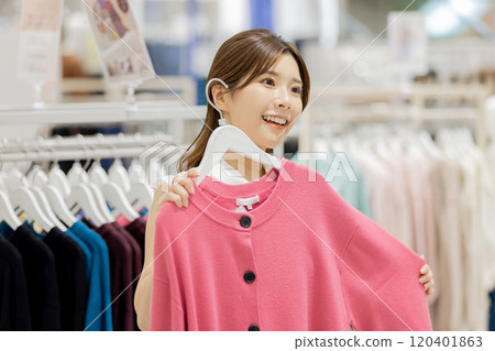 Woman enjoying shopping in a boutique 120401863