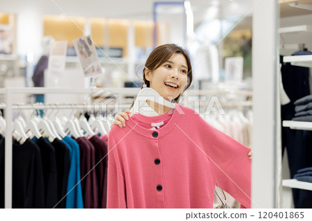 Woman enjoying shopping in a boutique 120401865