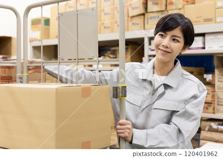 A woman working in a warehouse A woman working in a warehouse 120401962