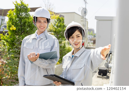 Workers inspecting substation equipment Workers inspecting substation equipment 120402154