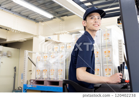 Logistics / Transportation industry: A man driving a forklift 120402238