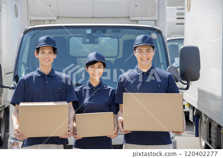 Image of logistics / transportation industry Men and women lined up in front of trucks 120402277