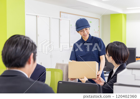 Business woman receiving deliveries Business woman receiving deliveries 120402360
